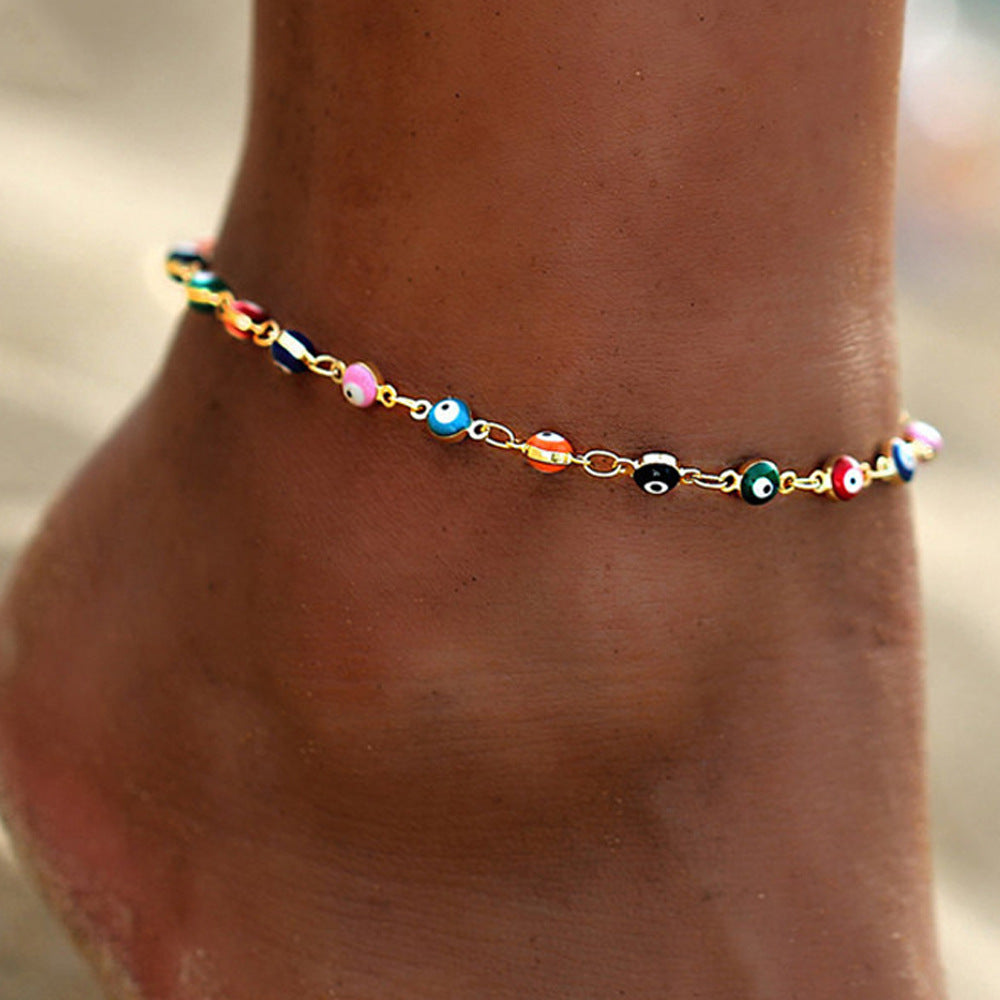 Elegant Women's Summer Anklet in 18K gold plating with gemstones, showcasing its adjustable design and luxurious shine.