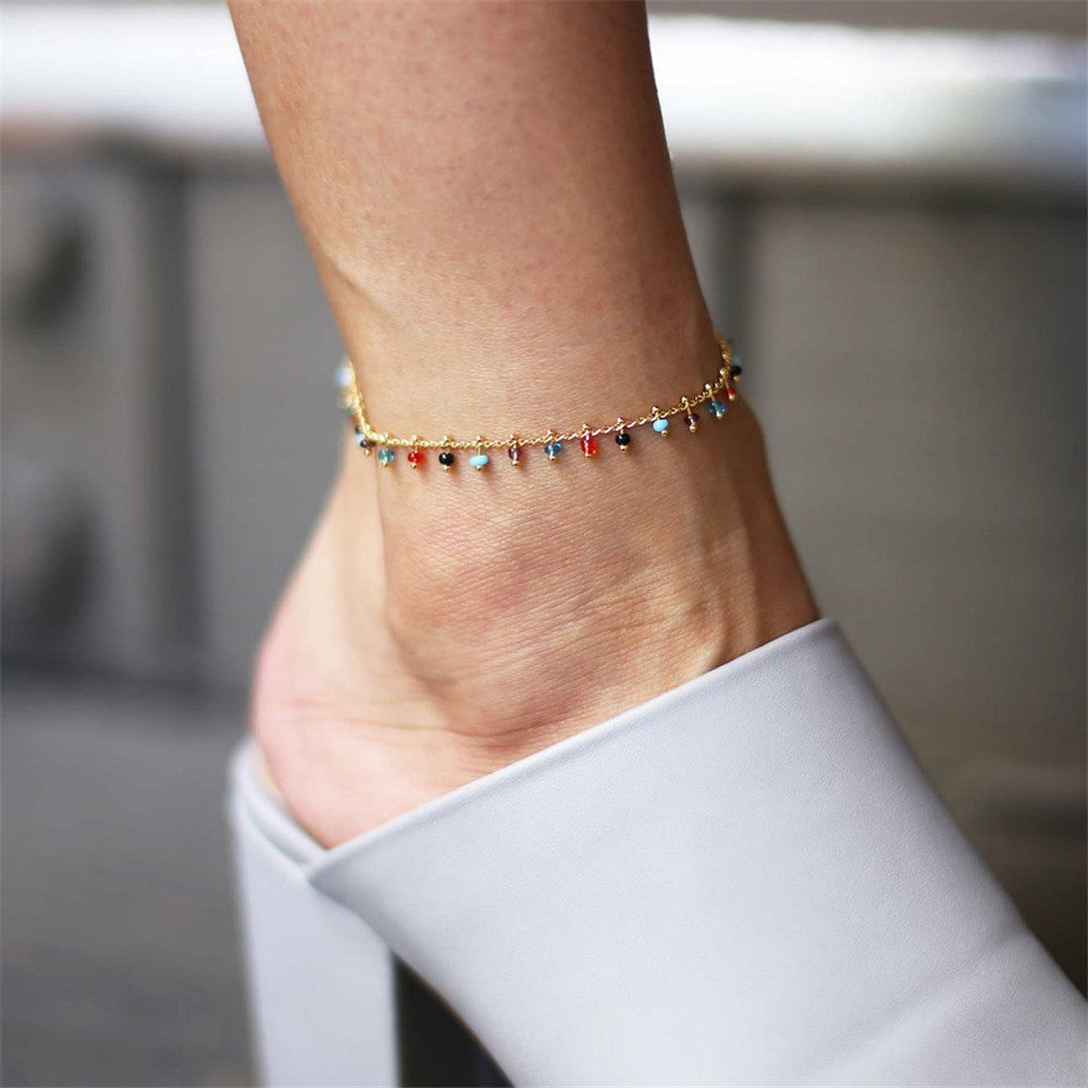 Elegant Women's Summer Anklet in 18K gold plating with gemstones, showcasing its adjustable design and luxurious shine.