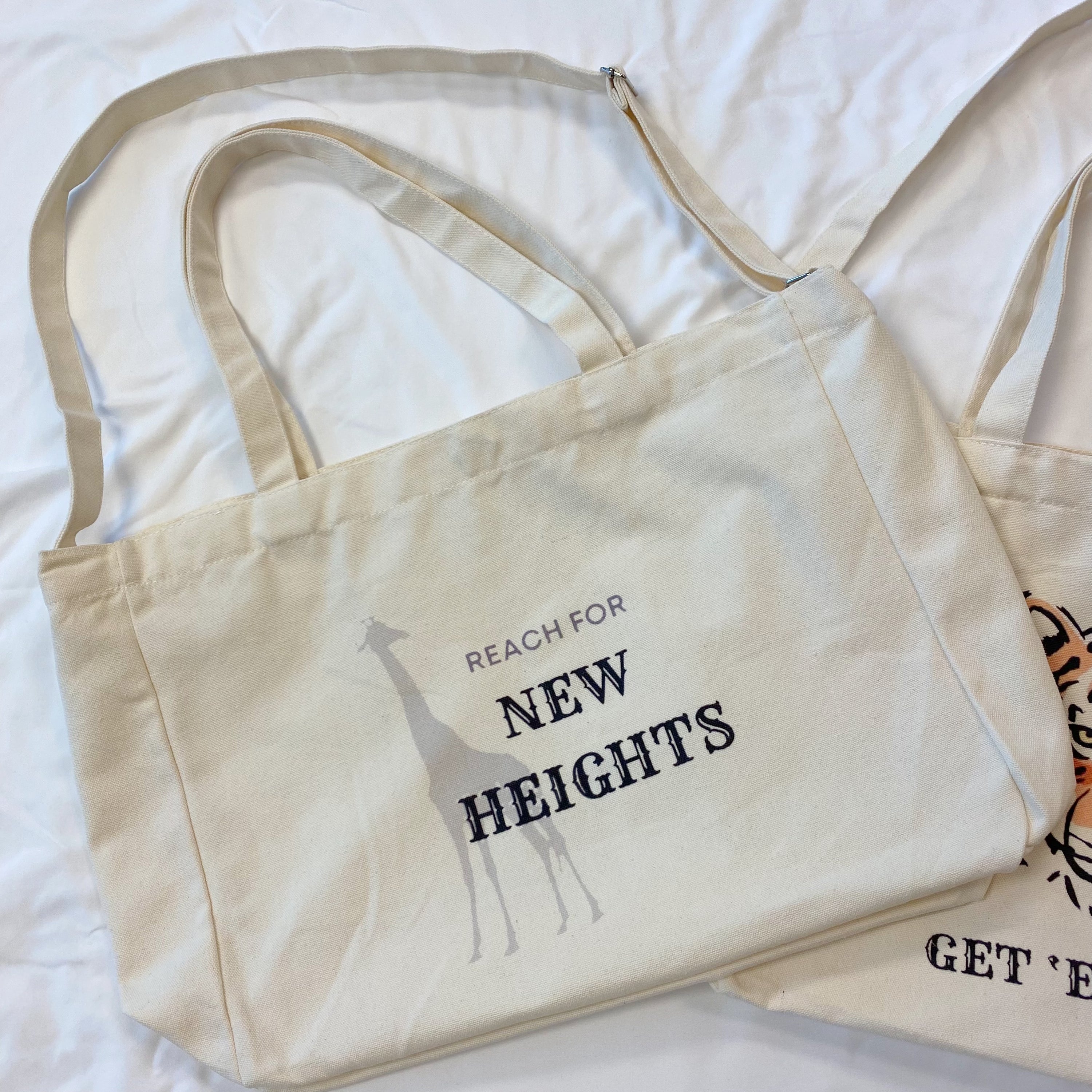 Words To Live By Canvas Tote featuring inspirational quotes, adjustable straps, and a spacious design for everyday use.