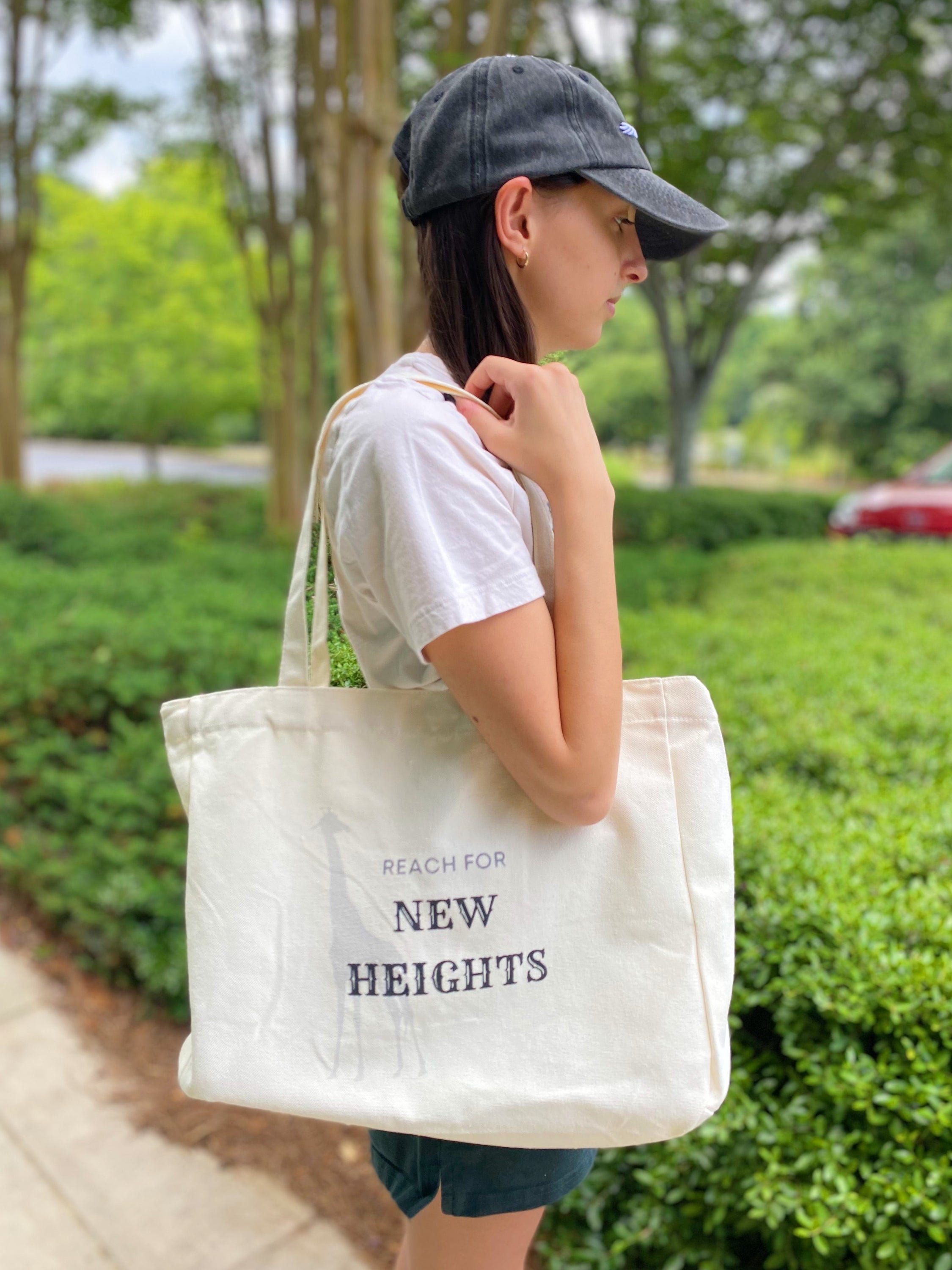 Words To Live By Canvas Tote featuring inspirational quotes, adjustable straps, and a spacious design for everyday use.