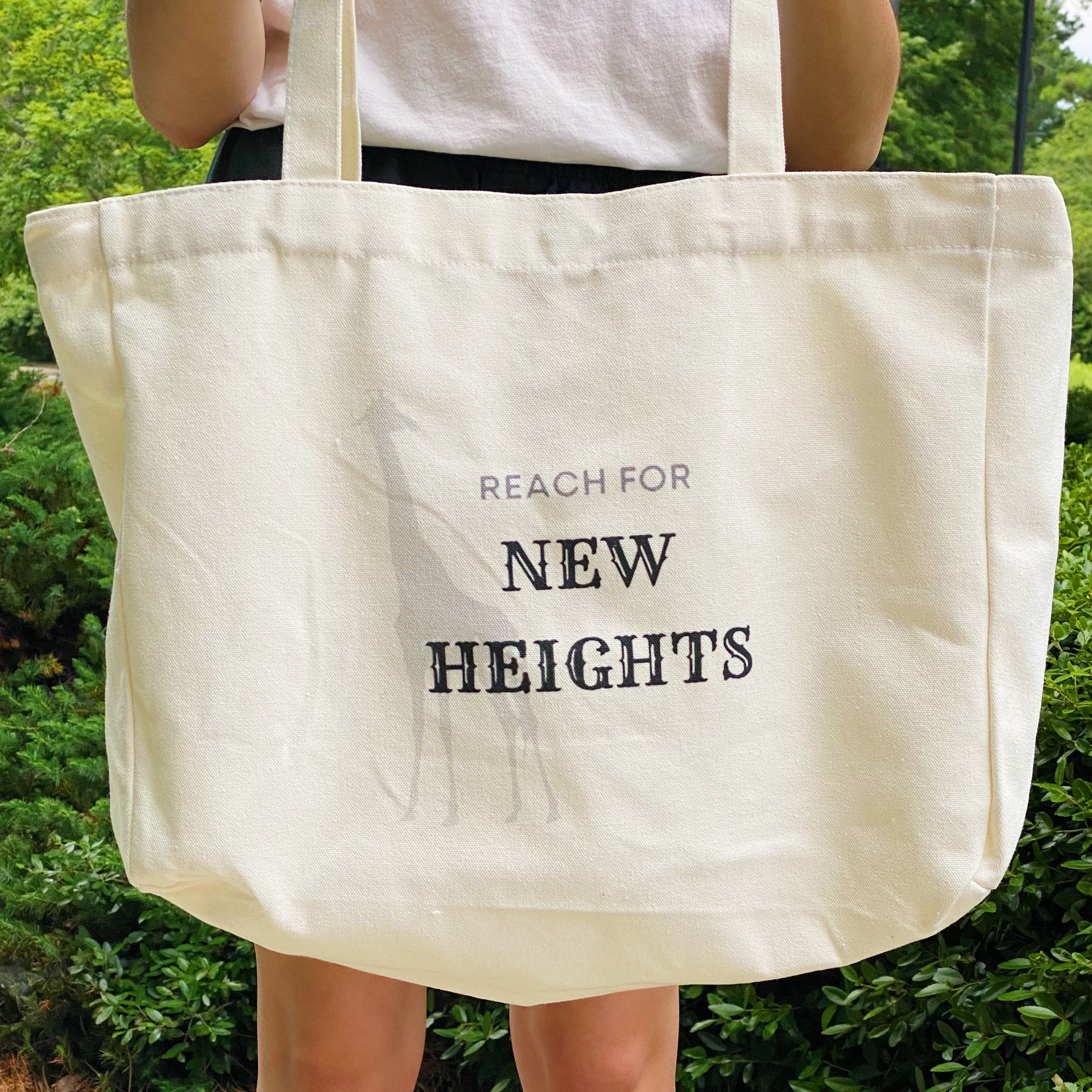 Words To Live By Canvas Tote featuring inspirational quotes, adjustable straps, and a spacious design for everyday use.