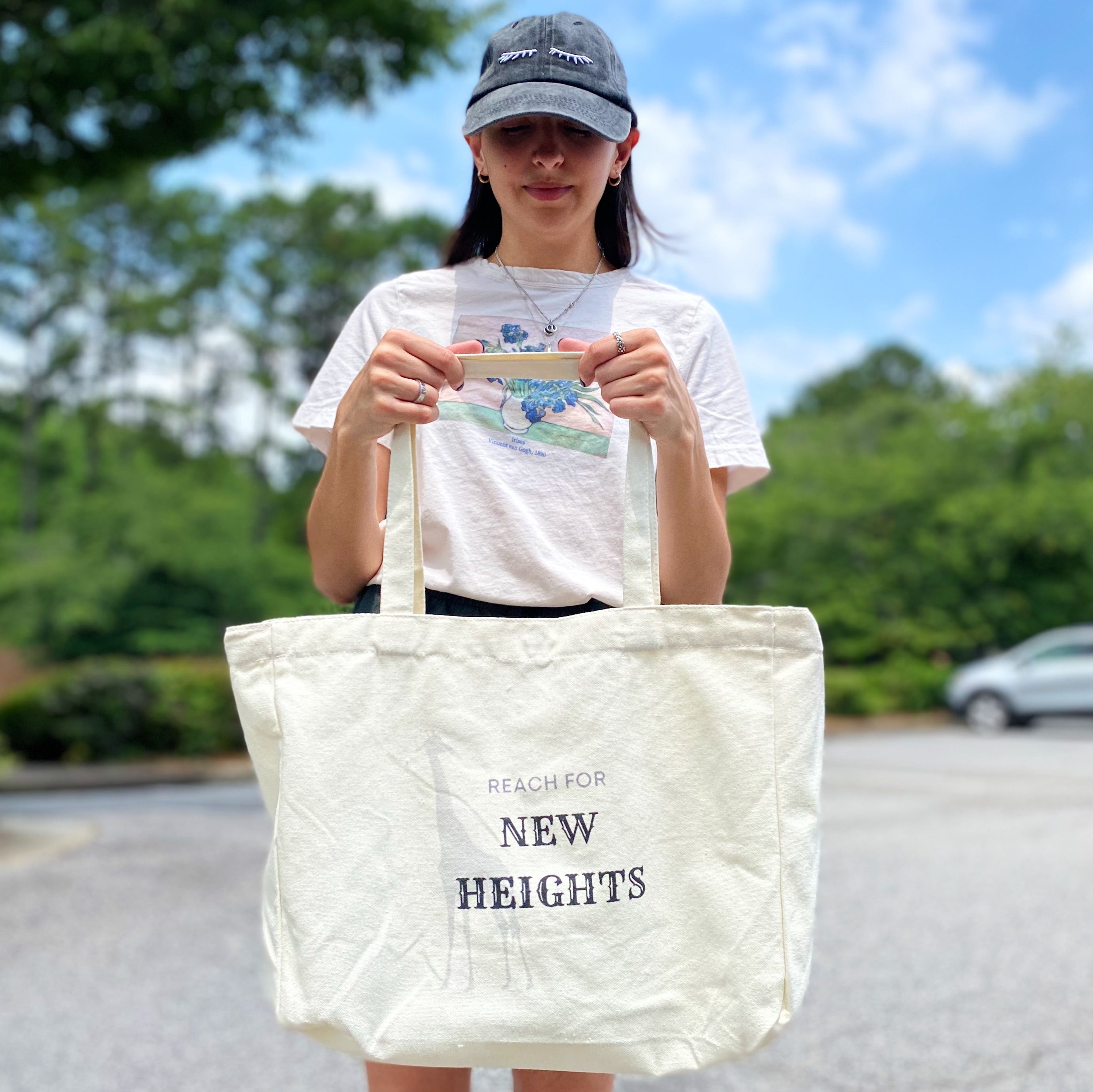 Words To Live By Canvas Tote featuring inspirational quotes, adjustable straps, and a spacious design for everyday use.