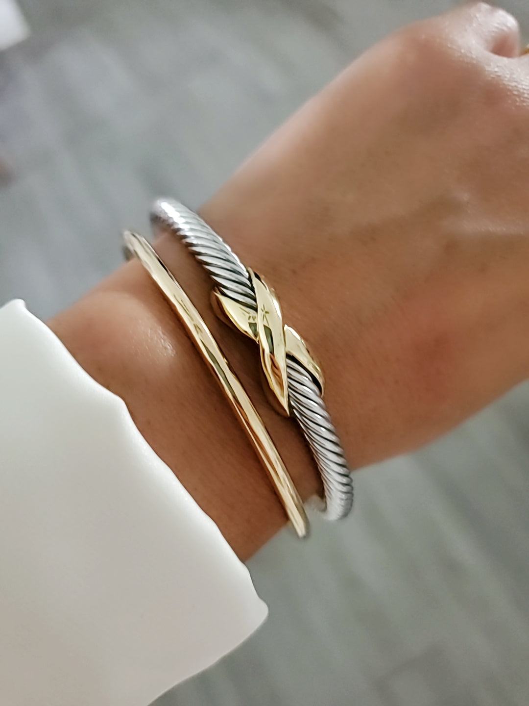 Elegant X Cable Bangle Bracelet with 18K Gold Filled details and unique X pattern, perfect for stacking or everyday wear.