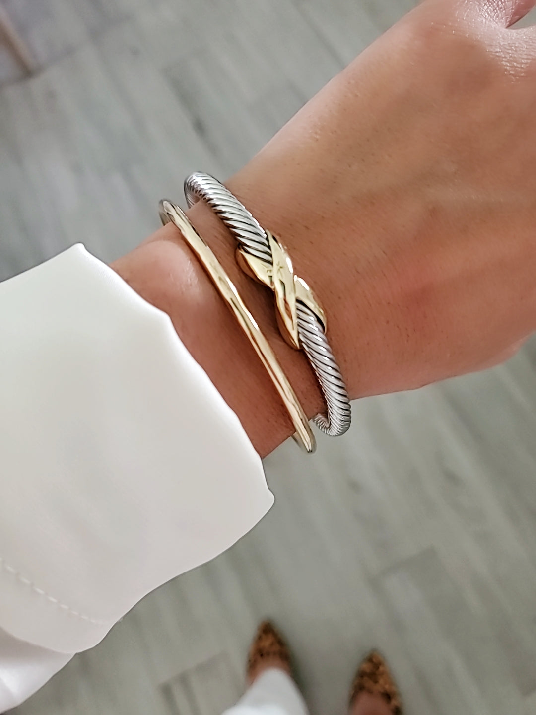 Elegant X Cable Bangle Bracelet with 18K Gold Filled details and unique X pattern, perfect for stacking or everyday wear.