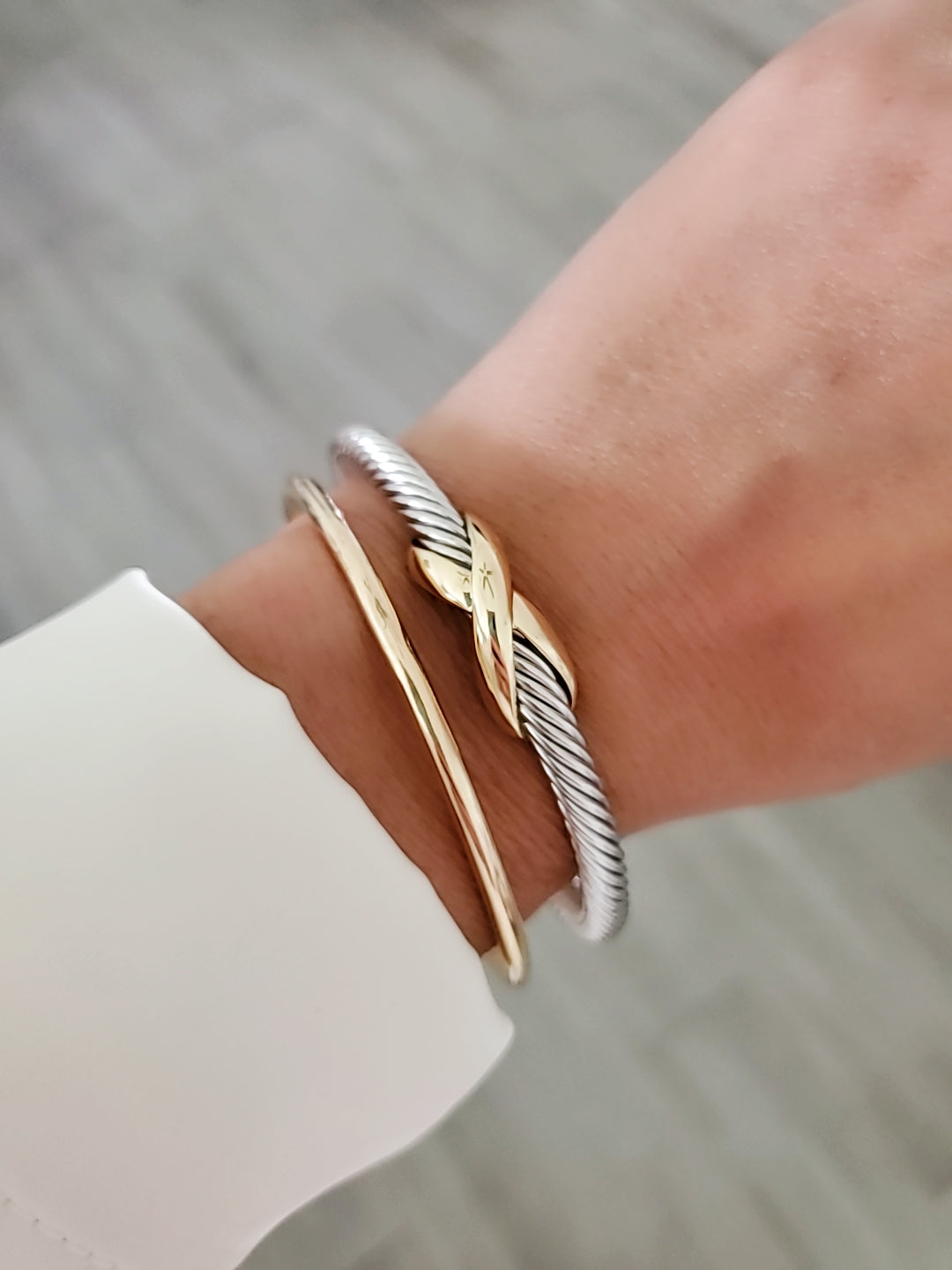 Elegant X Cable Bangle Bracelet with 18K Gold Filled details and unique X pattern, perfect for stacking or everyday wear.