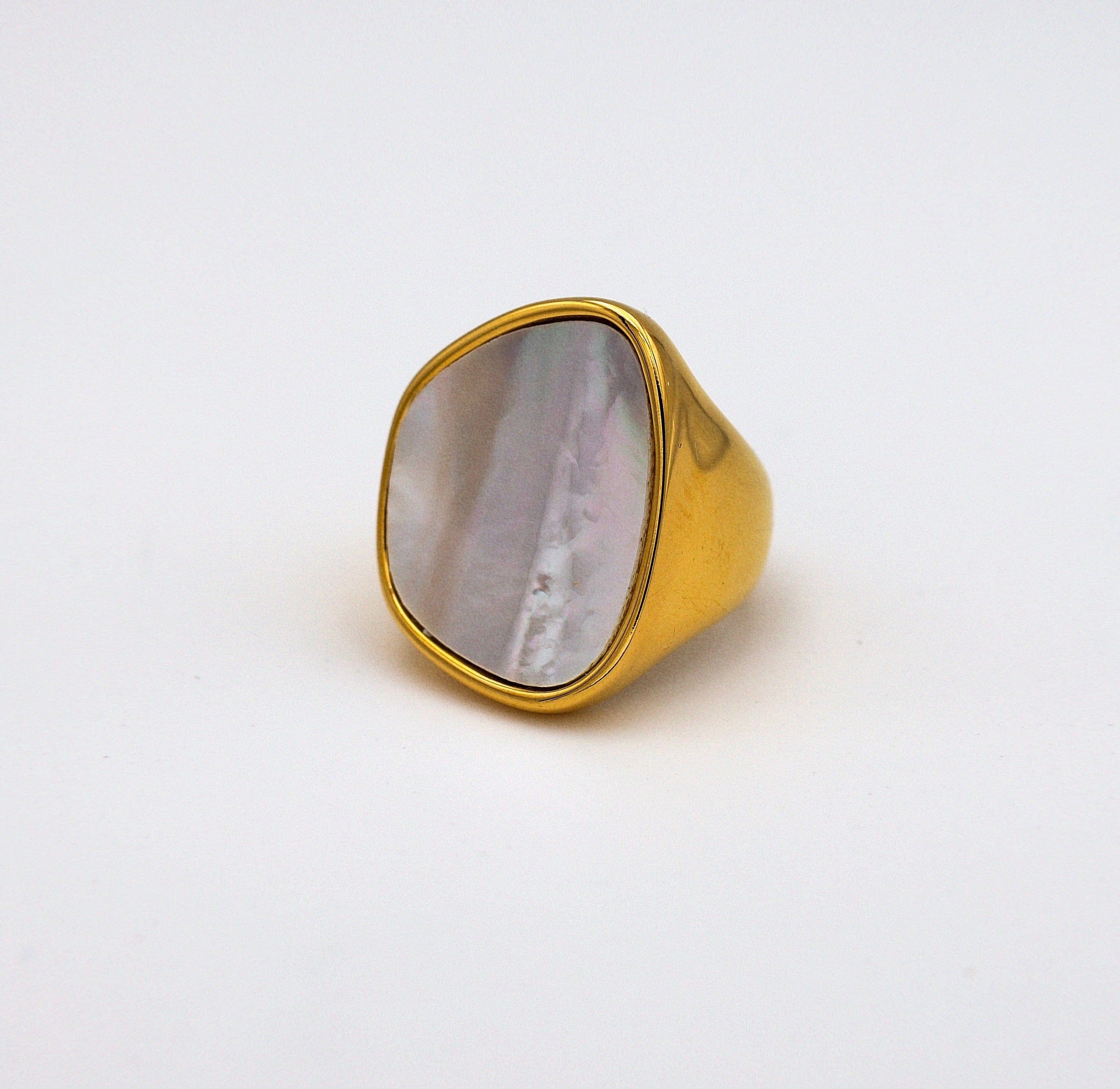 Xenia Large Antique Mother of Pearl Ring featuring a bold geometric design with an 18K gold plated stainless steel band and natural white shell stone.