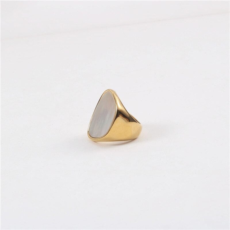 Xenia Large Antique Mother of Pearl Ring featuring a bold geometric design with an 18K gold plated stainless steel band and natural white shell stone.