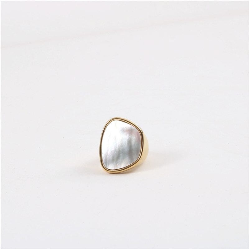 Xenia Large Antique Mother of Pearl Ring featuring a bold geometric design with an 18K gold plated stainless steel band and natural white shell stone.