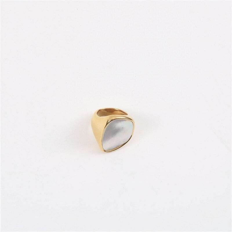 Xenia Large Antique Mother of Pearl Ring featuring a bold geometric design with an 18K gold plated stainless steel band and natural white shell stone.