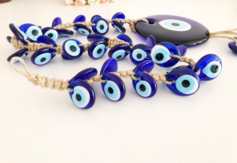 X-Large evil eye wall hanging featuring 41 unique beads, including a large 13cm bead and 40 smaller glass beads, beautifully handcrafted.