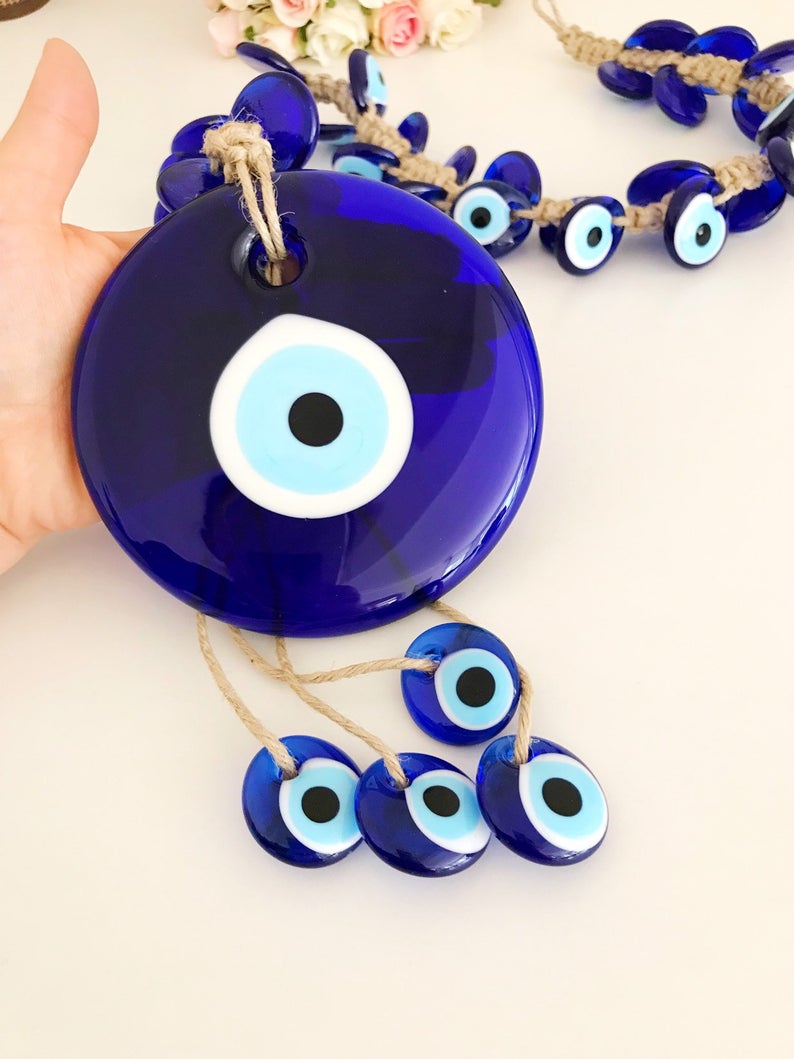 X-Large evil eye wall hanging featuring 41 unique beads, including a large 13cm bead and 40 smaller glass beads, beautifully handcrafted.