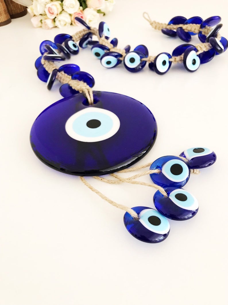 X-Large evil eye wall hanging featuring 41 unique beads, including a large 13cm bead and 40 smaller glass beads, beautifully handcrafted.