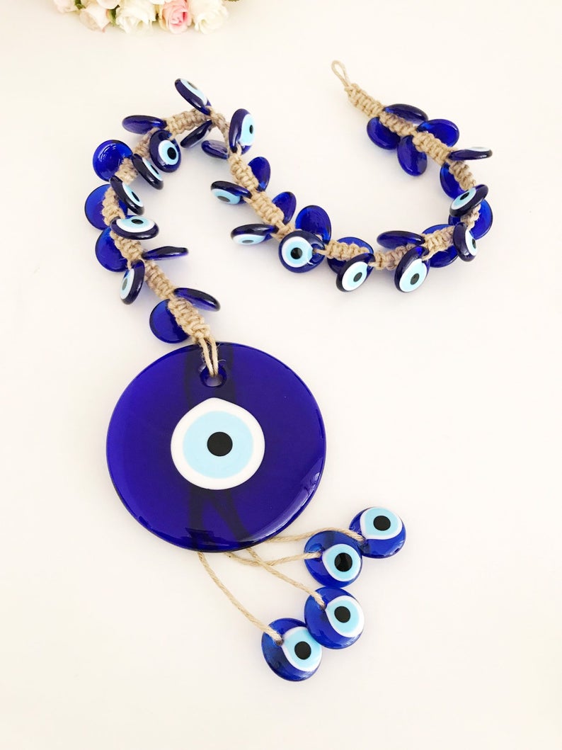 X-Large evil eye wall hanging featuring 41 unique beads, including a large 13cm bead and 40 smaller glass beads, beautifully handcrafted.