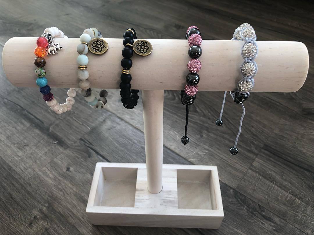 Yoga Bracelets featuring black beaded natural agate stones with lotus flower and Om symbol charms, elegantly designed for spiritual healing.