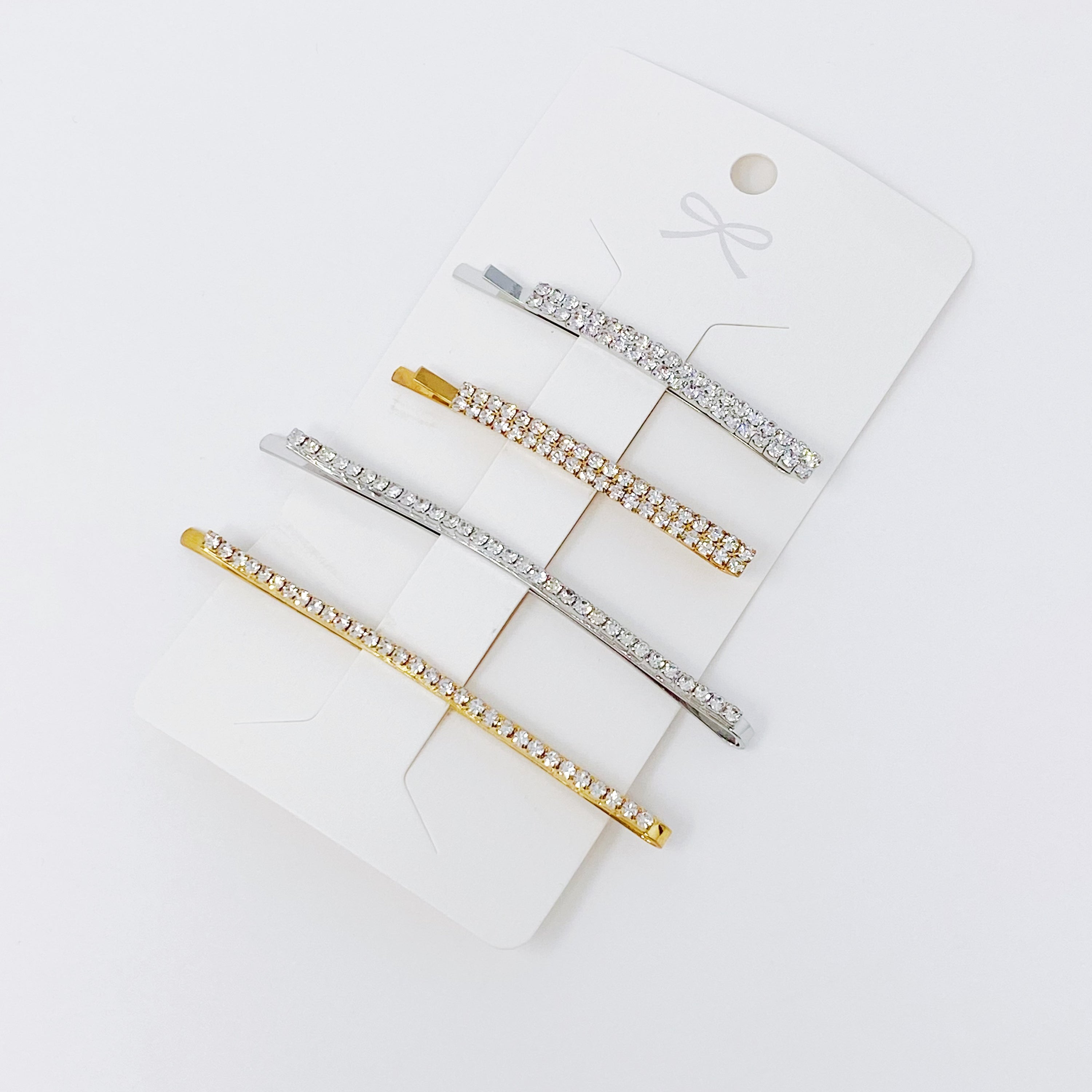 Your Shiness CZ Hair Pin Set featuring 4 shiny bobby pins in gold and silver tones, displayed in a clear cello bag.