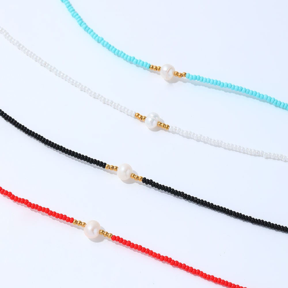 Zagros Beaded Pearl Choker Necklace featuring natural pearls and colored beads on a gold chain.