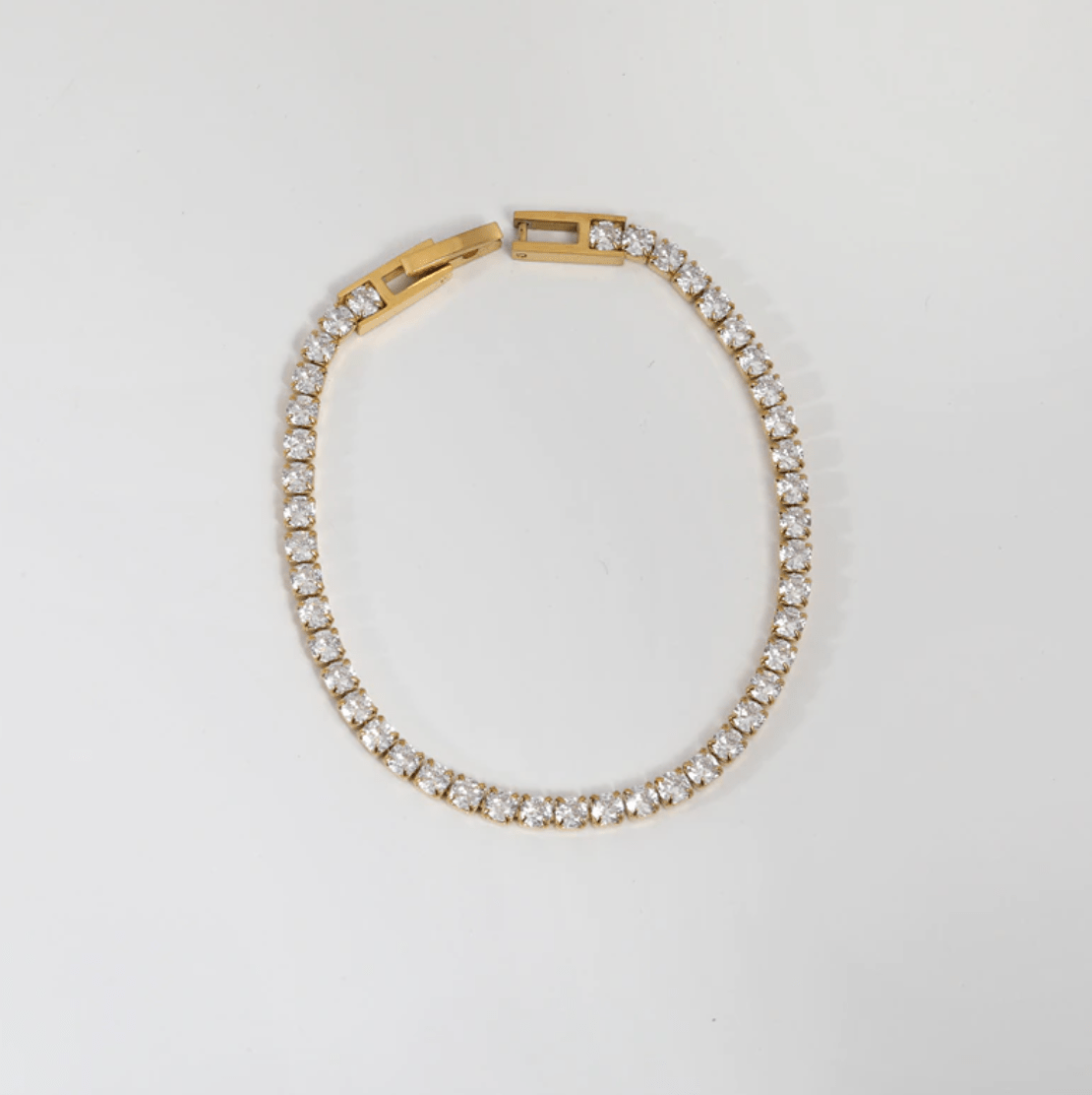 Zebedeo Crystal Choker Necklace featuring clear crystals and 18K gold plating on a stainless steel chain, elegantly displayed.