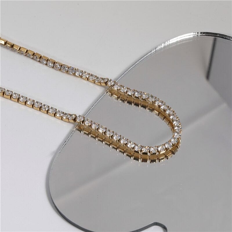 Zebedeo Crystal Choker Necklace featuring clear crystals and 18K gold plating on a stainless steel chain, elegantly displayed.