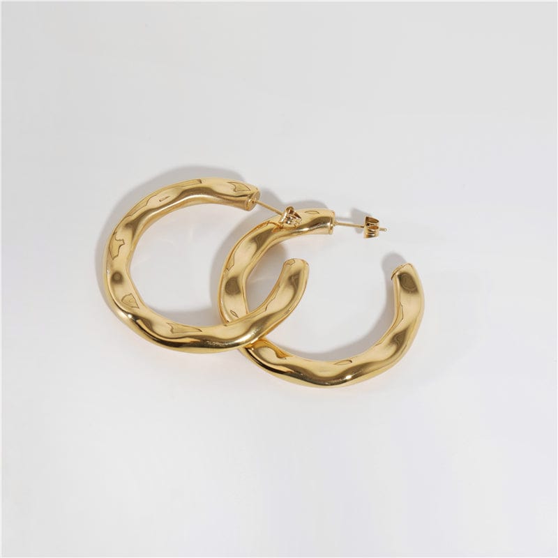 Zhenya Largest Hoop Earrings in gold and silver, showcasing a thick chunky design perfect for modern and vintage styles.