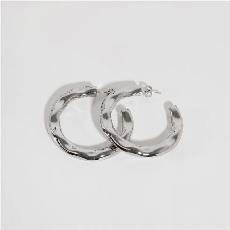 Zhenya Largest Hoop Earrings in gold and silver, showcasing a thick chunky design perfect for modern and vintage styles.