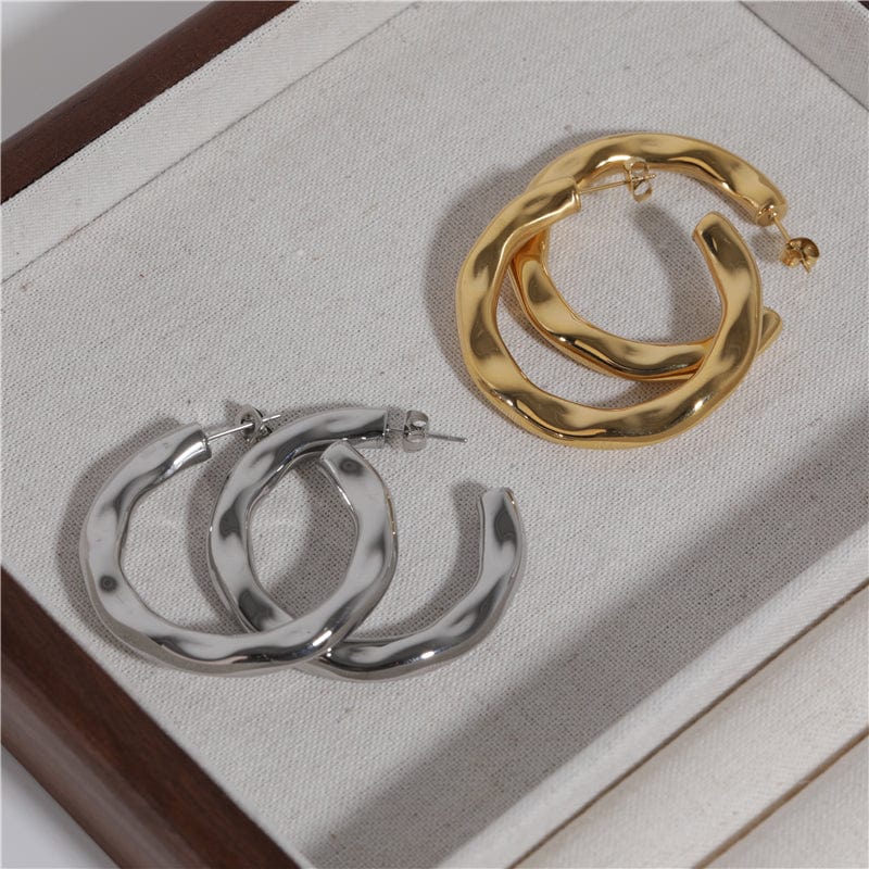 Zhenya Largest Hoop Earrings in gold and silver, showcasing a thick chunky design perfect for modern and vintage styles.