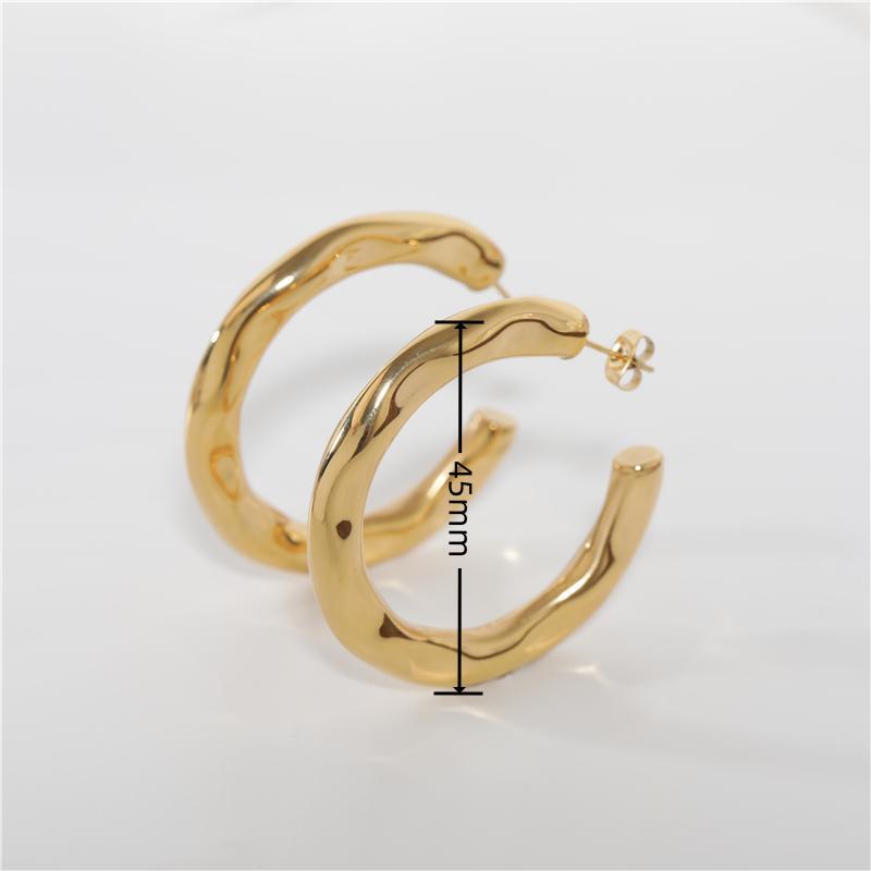 Zhenya Largest Hoop Earrings in gold and silver, showcasing a thick chunky design perfect for modern and vintage styles.