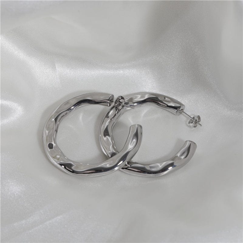 Zhenya Largest Hoop Earrings in gold and silver, showcasing a thick chunky design perfect for modern and vintage styles.