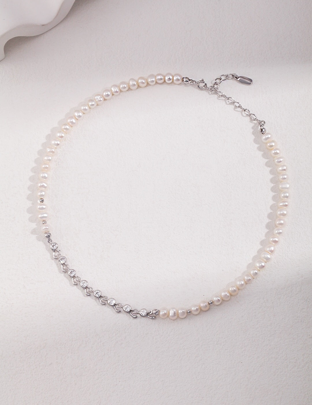 Elegant Zircon Chain Splice Natural Pearl Necklace featuring natural pearls, zircon stones, and gold vermeil accents, displayed on a soft background.