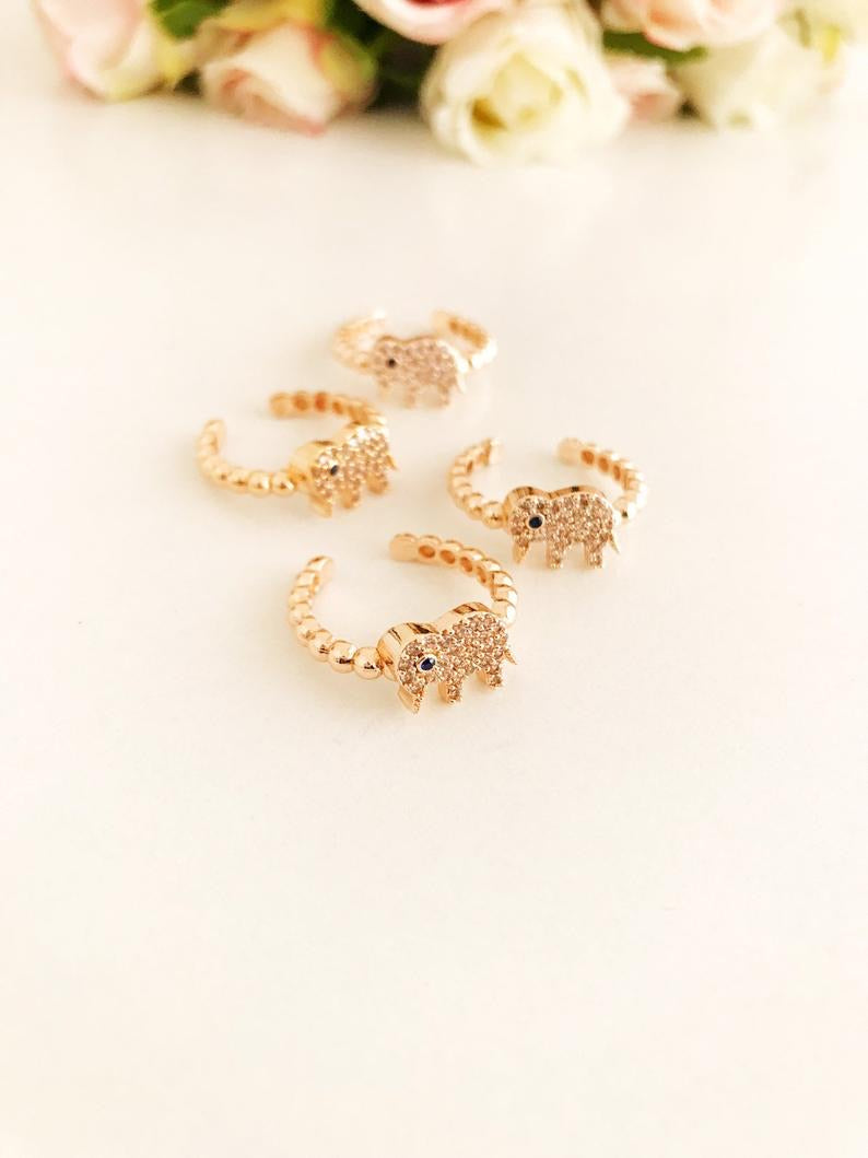 A beautiful adjustable Zirconia Elephant Ring featuring rose gold and sparkling zirconia beads, symbolizing good luck and charm.