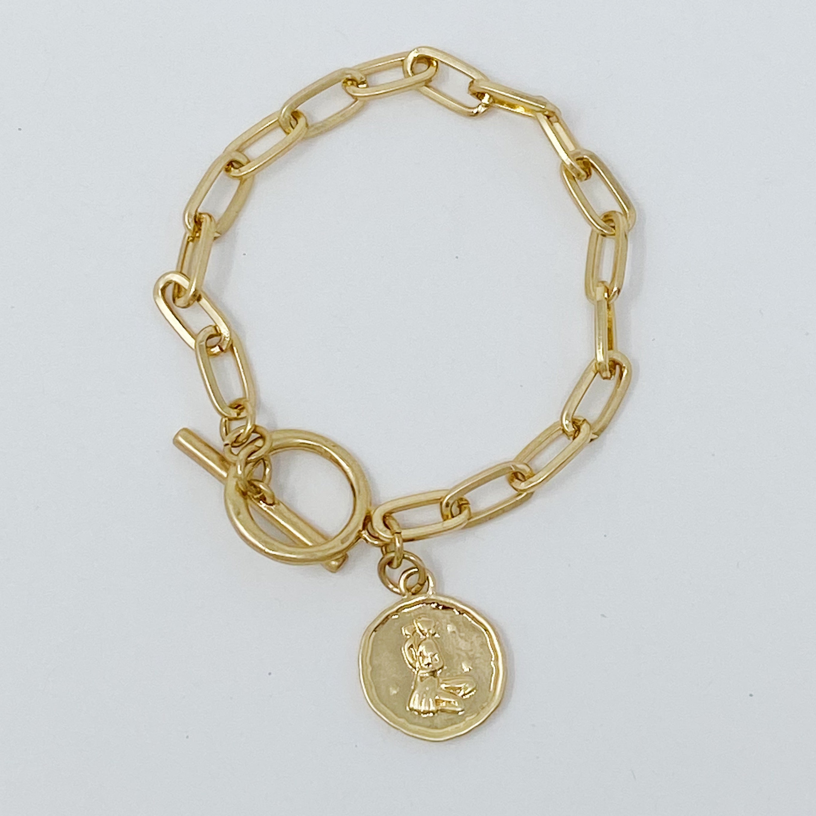 Zodiac Charm Chain Bracelet featuring a gold dipped brass link chain and a zodiac sign charm.