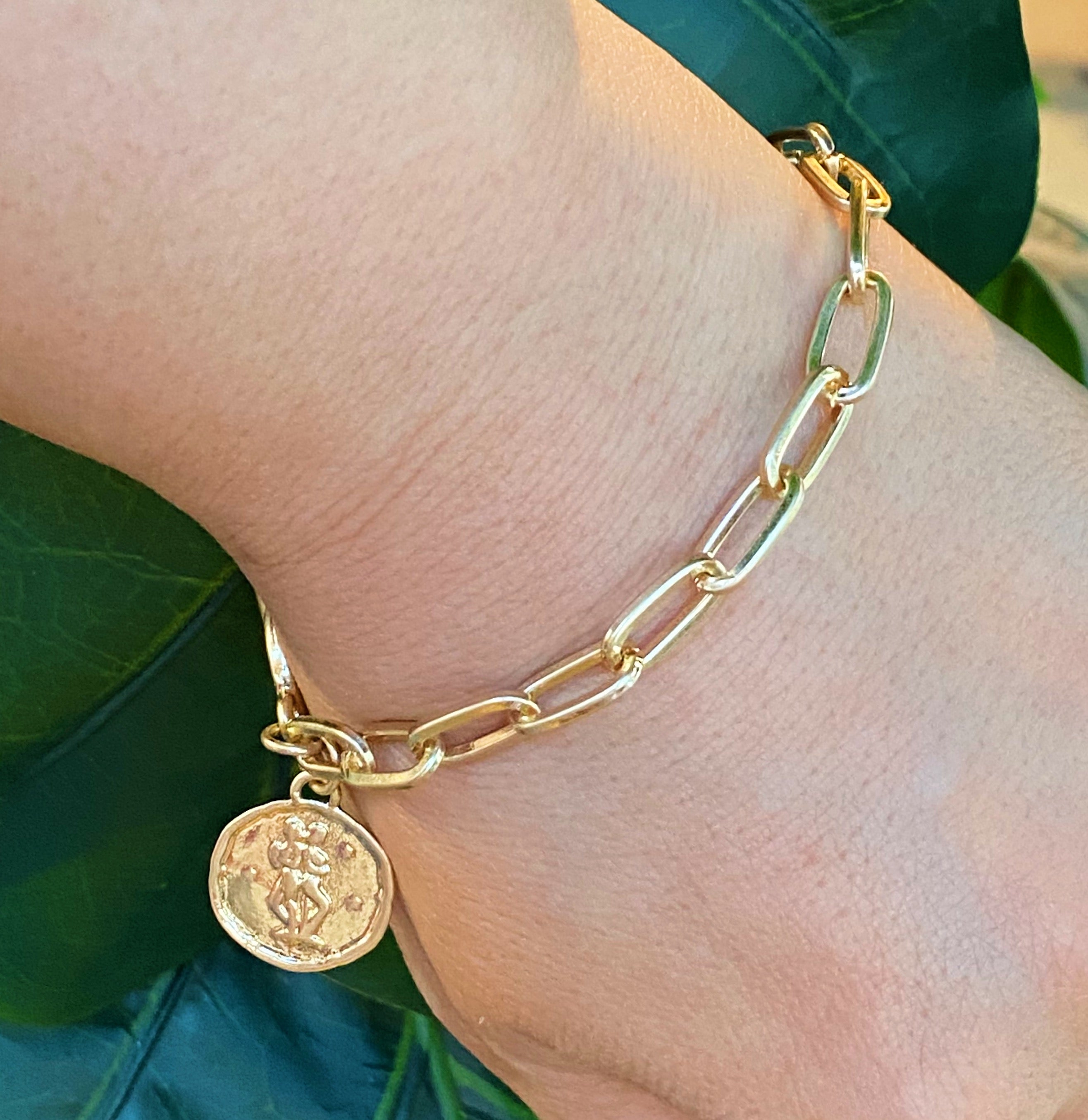 Zodiac Charm Chain Bracelet featuring a gold dipped brass link chain and a zodiac sign charm.