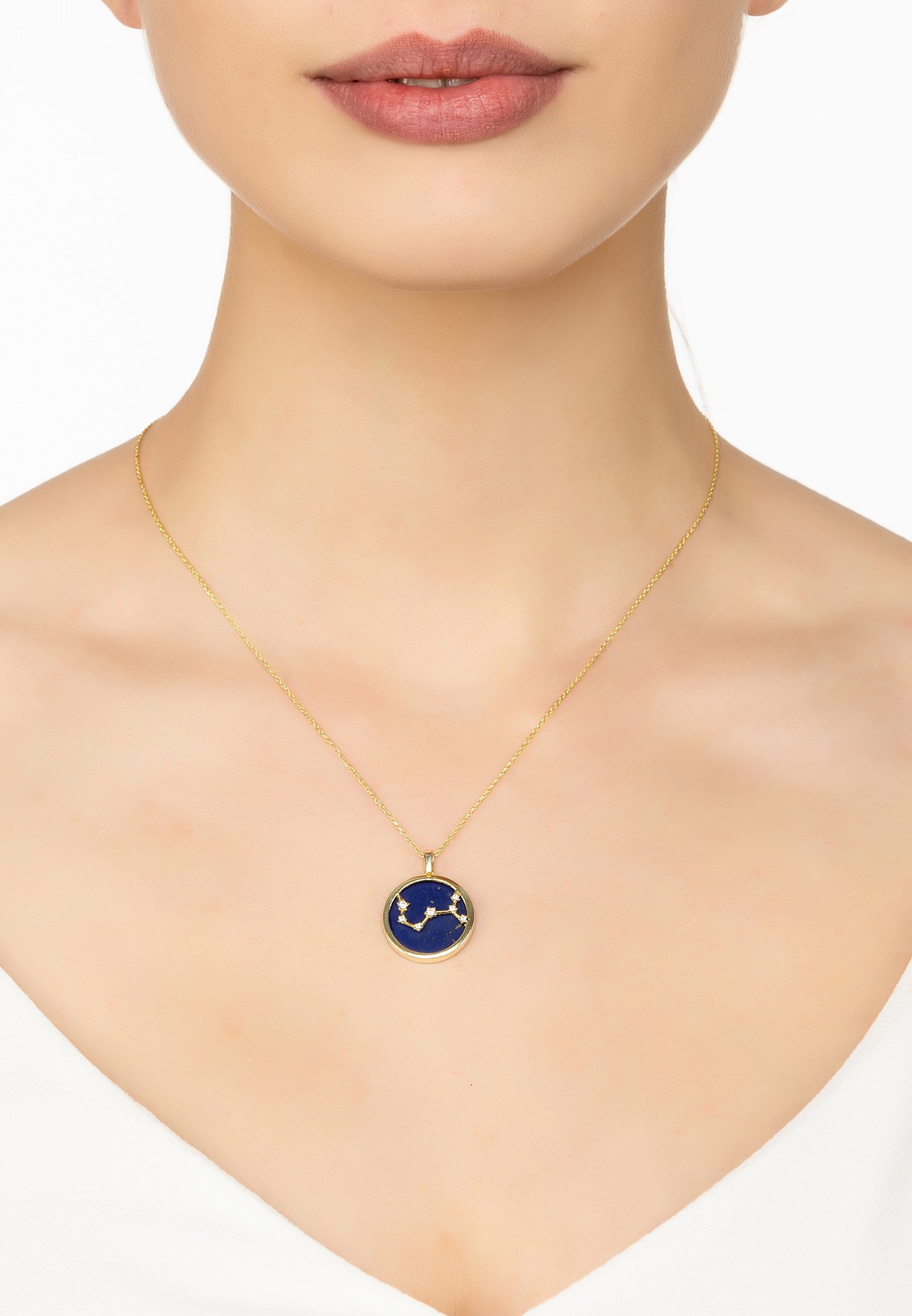 Zodiac Lapis Lazuli Gemstone Star Constellation Pendant Necklace in gold, featuring a dark blue lapis lazuli stone and sparkling cubic zirconia.