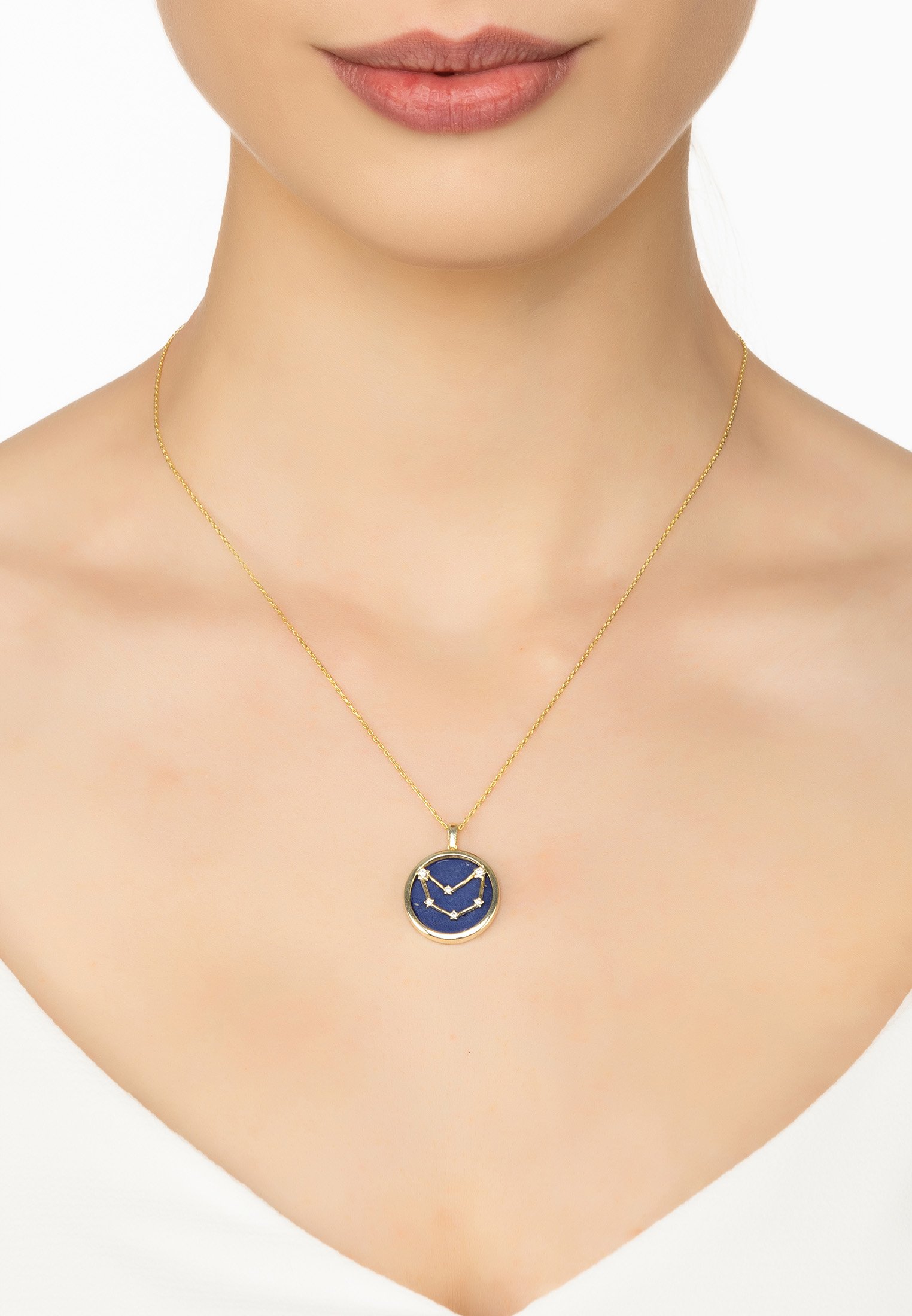 Zodiac Lapis Lazuli Gemstone Star Constellation Pendant Necklace in gold, featuring a dark blue lapis lazuli stone and sparkling cubic zirconia.