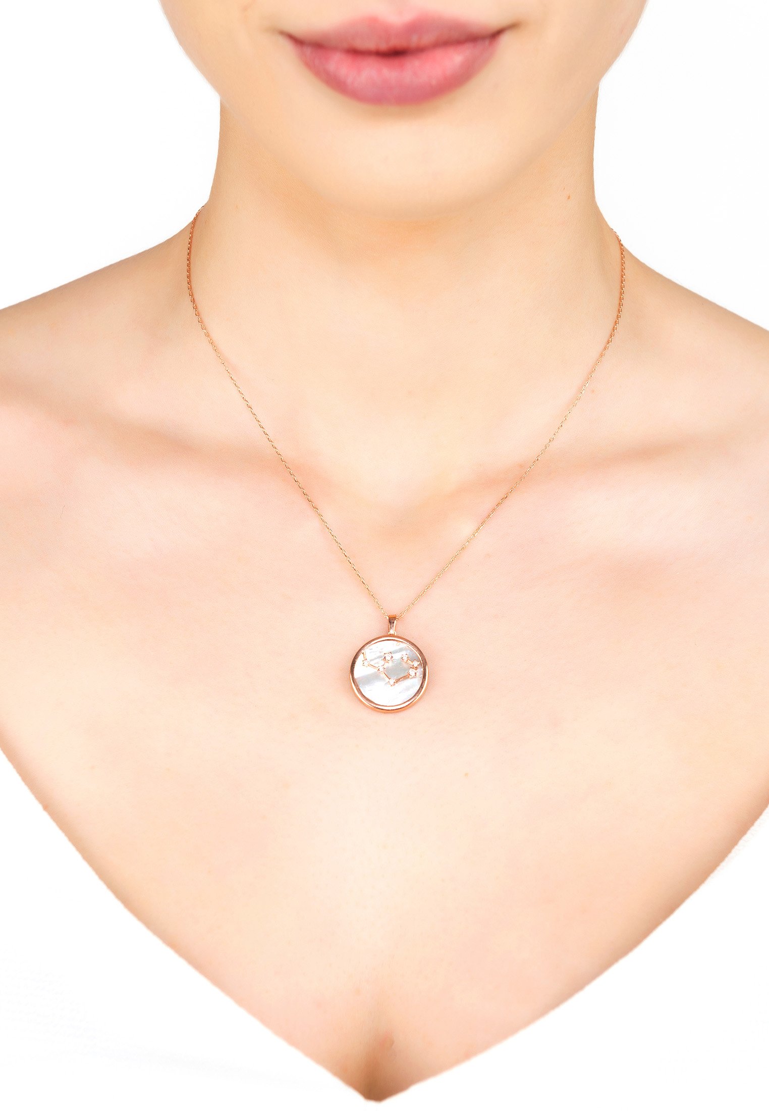 Zodiac Mother Of Pearl Pendant Necklace featuring a Sagittarius constellation design with sparkling cubic zirconia accents in rose gold dipped sterling silver.