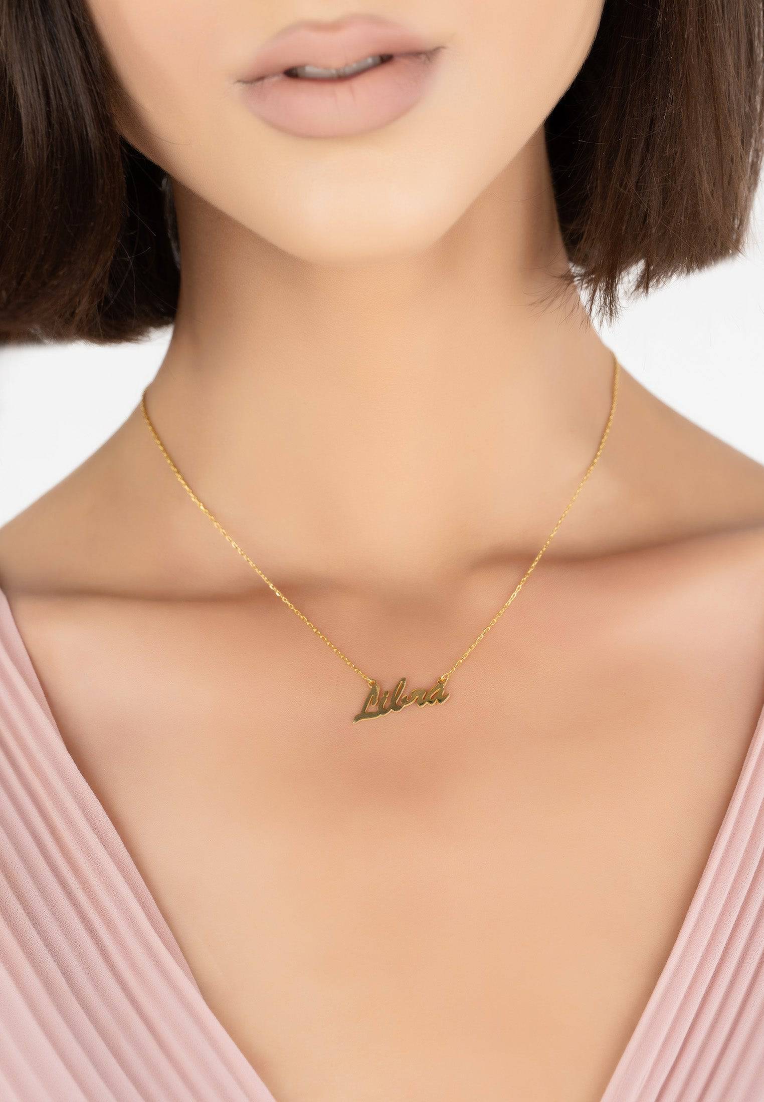 Gold Libra Zodiac Star Sign Name Necklace, crafted from 925 sterling silver and dipped in 22ct gold, featuring a delicate script design.