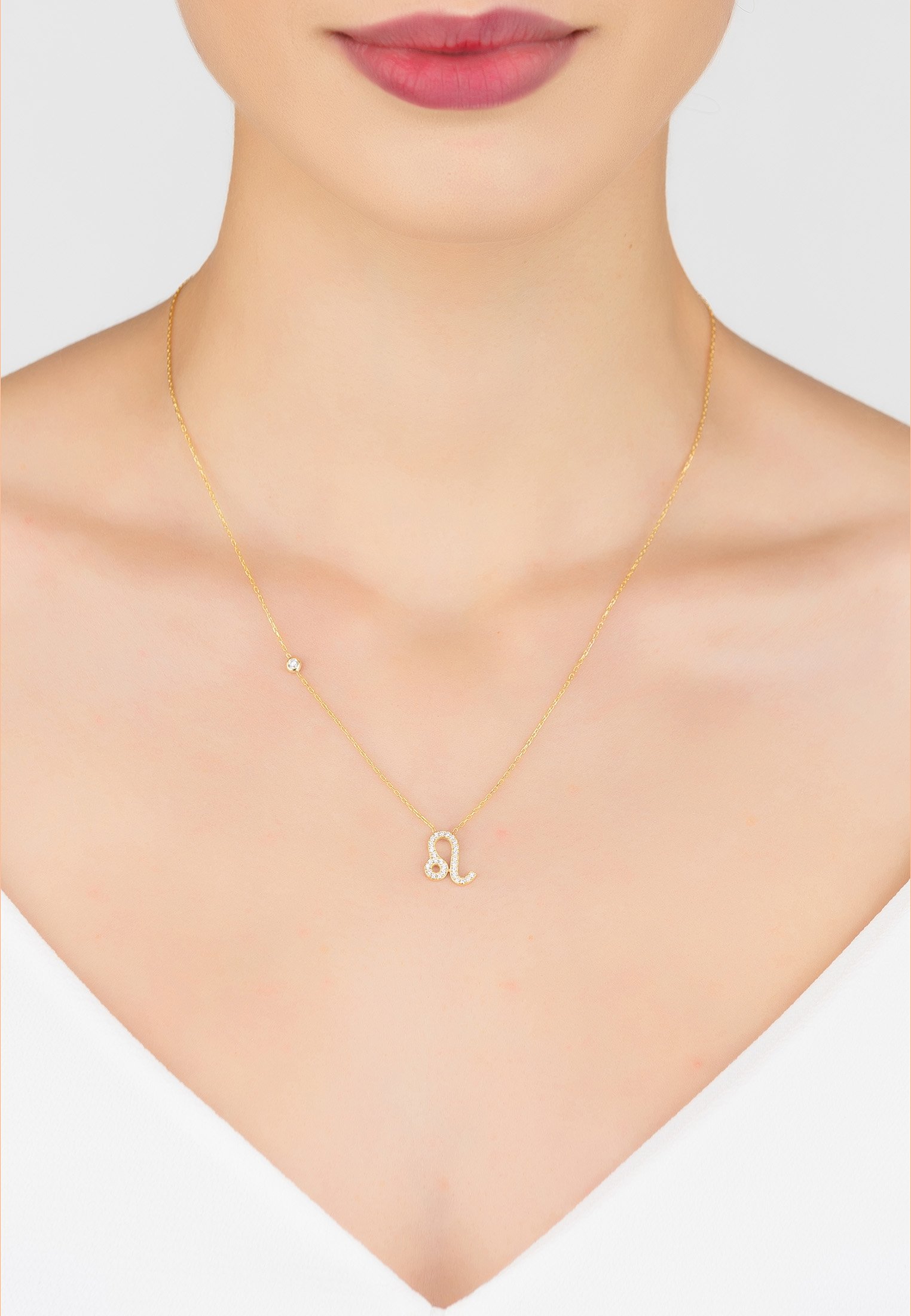 Gold Leo Zodiac Star Sign Pendant Necklace with white zircons, adjustable chain, and lobster clasp.