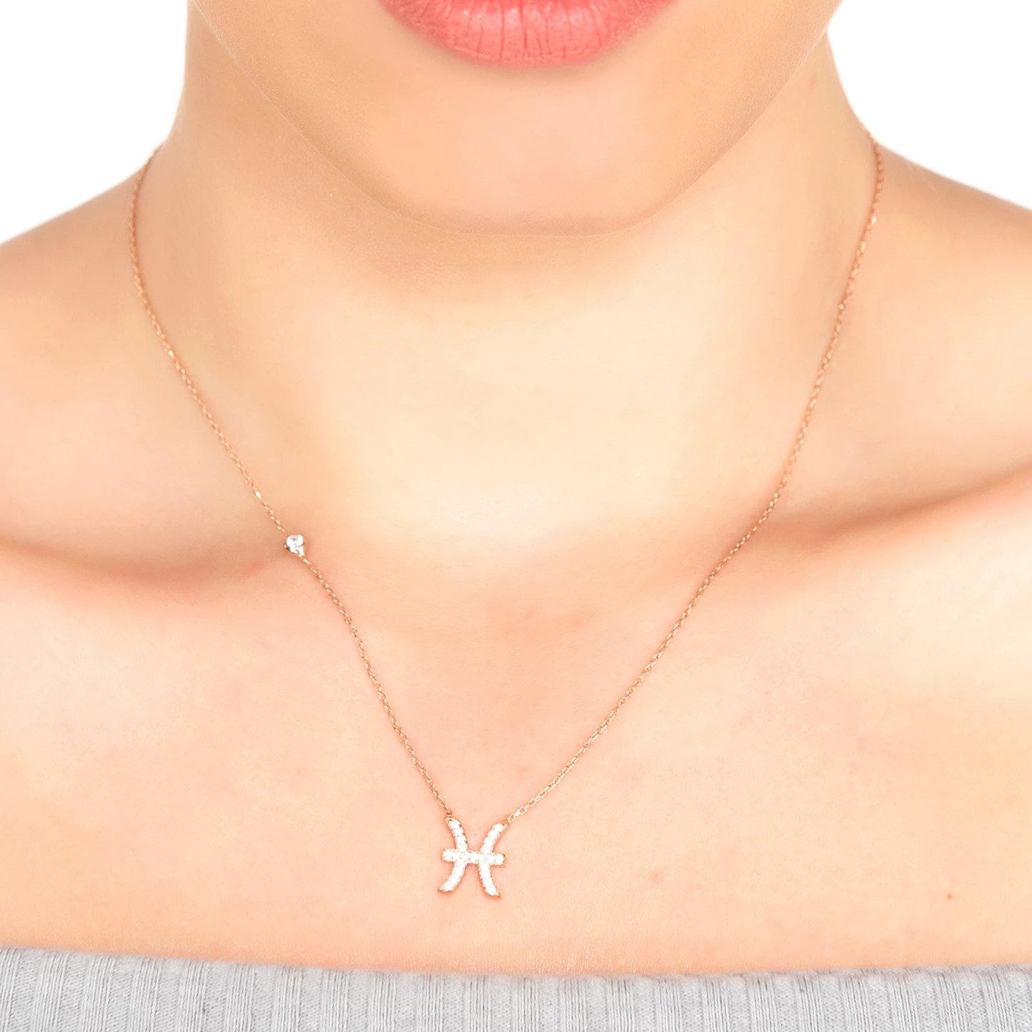 Silver Zodiac Star Sign Pendant Necklace for Pisces with white zircons, displayed elegantly.