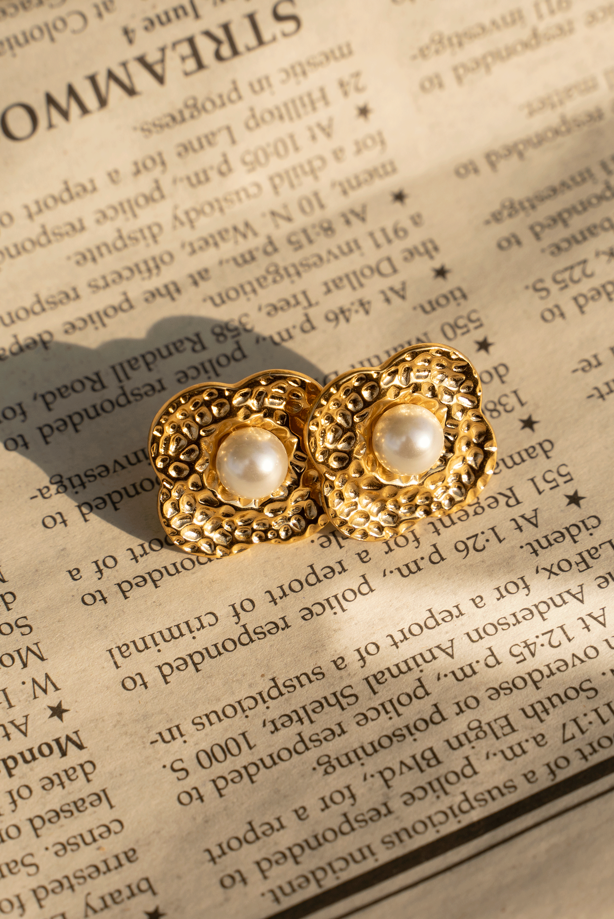 ZYANA Studs featuring hammered flower petals and shimmering pearls, crafted from 18k gold plated stainless steel.