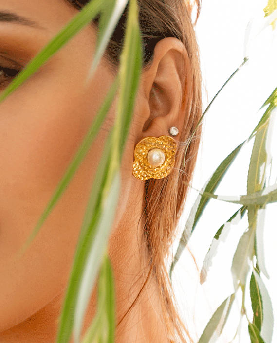 ZYANA Studs featuring hammered flower petals and shimmering pearls, crafted from 18k gold plated stainless steel.