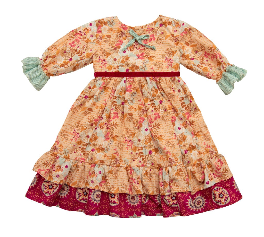 Amber Dreams Dress featuring autumn leaves and whimsical polka dots, perfect for little girls.