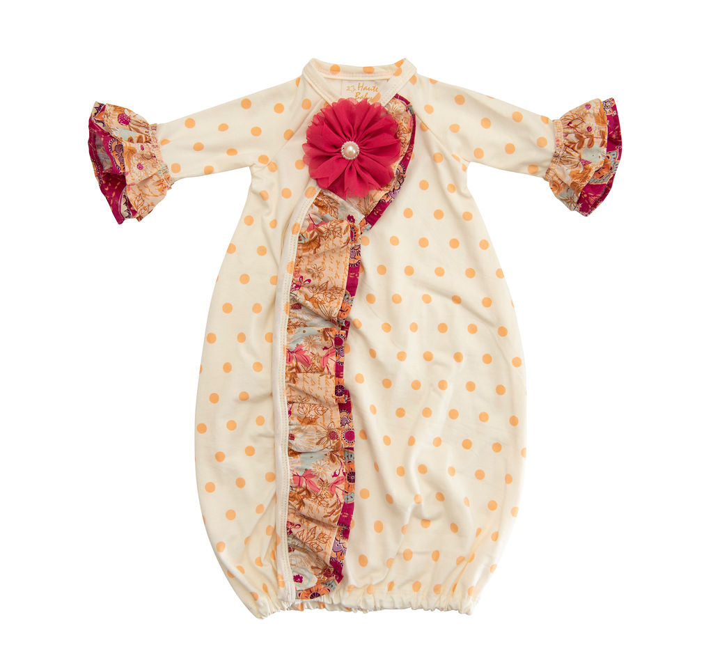 Amber Dreams Gown featuring autumn leaves and polka dot print for baby girls, showcasing its soft fabric and charming design.