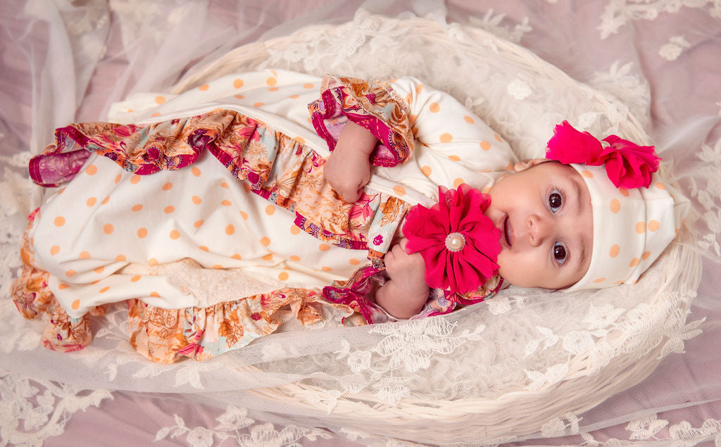 Amber Dreams Gown featuring autumn leaves and polka dot print for baby girls, showcasing its soft fabric and charming design.