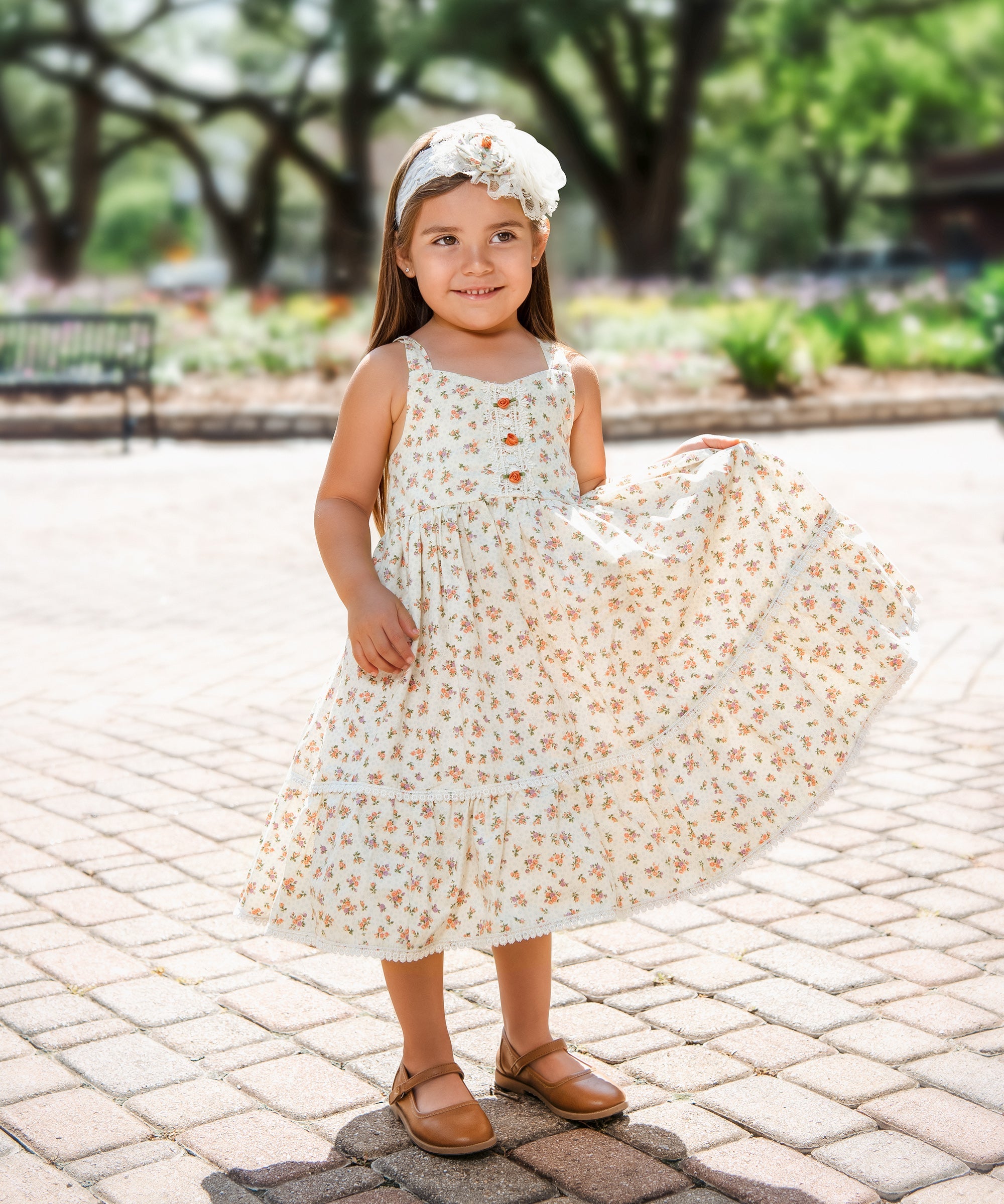 The Arabella Dress featuring a vintage floral pattern with an A-line silhouette, perfect for elegant occasions.