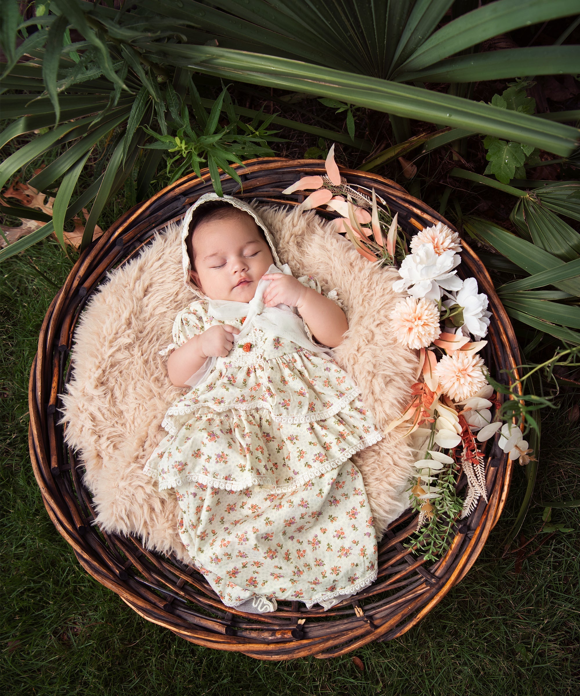 A beautiful floral vintage baby gown with delicate lace trims and puffed sleeves, perfect for special occasions.