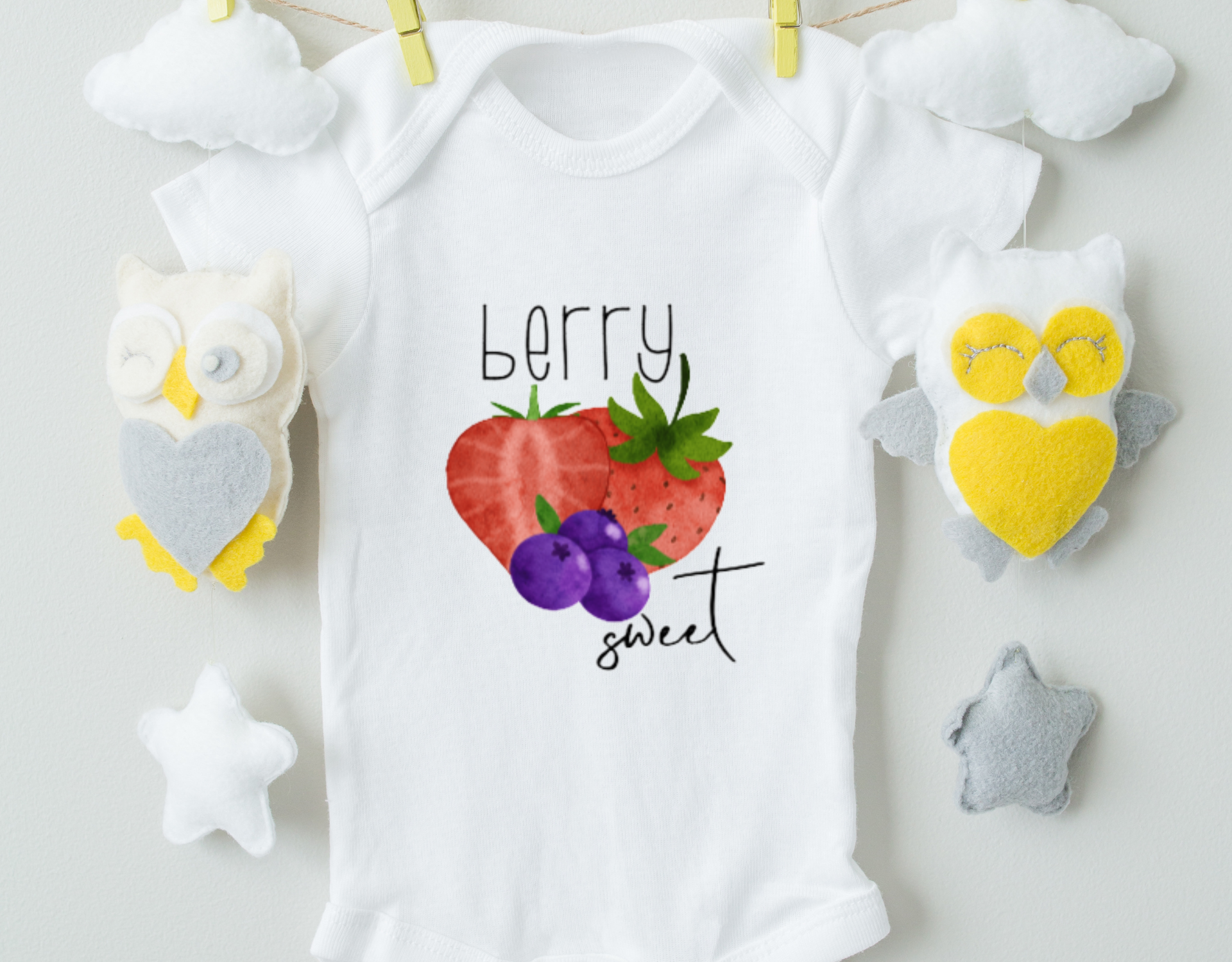 Berry Sweet Bodysuit made of 100% cotton with a vibrant heat transfer vinyl design, featuring an expandable neckline and snap closure.