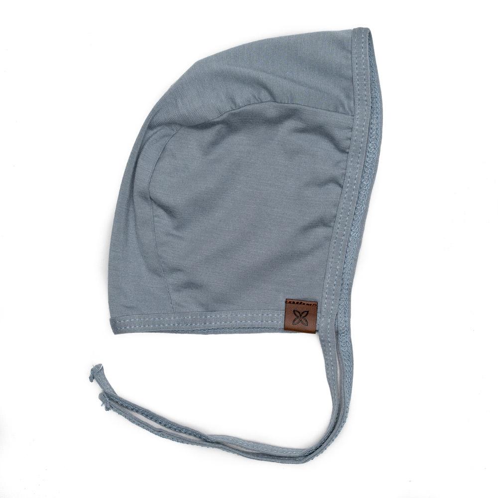 A cozy baby bonnet designed for warmth and comfort, featuring soft fabric and a snug fit, perfect for chilly weather.