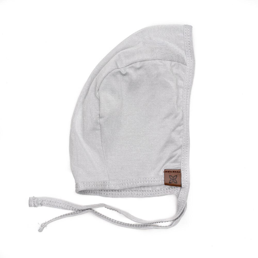 A cozy baby bonnet designed for warmth and comfort, featuring soft fabric and a snug fit, perfect for chilly weather.