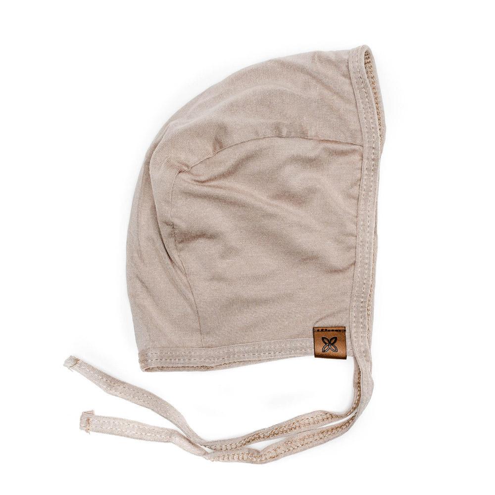 A cozy baby bonnet designed for warmth and comfort, featuring soft fabric and a snug fit, perfect for chilly weather.