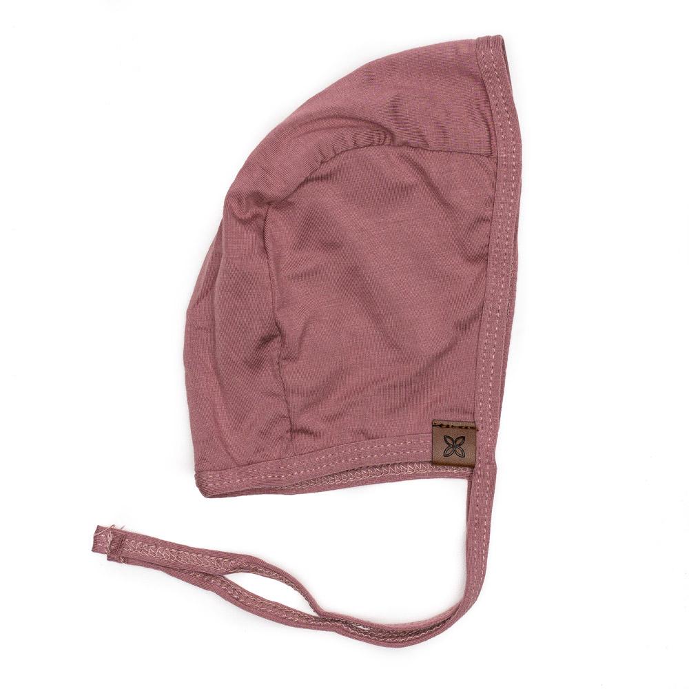 A cozy baby bonnet designed for warmth and comfort, featuring soft fabric and a snug fit, perfect for chilly weather.