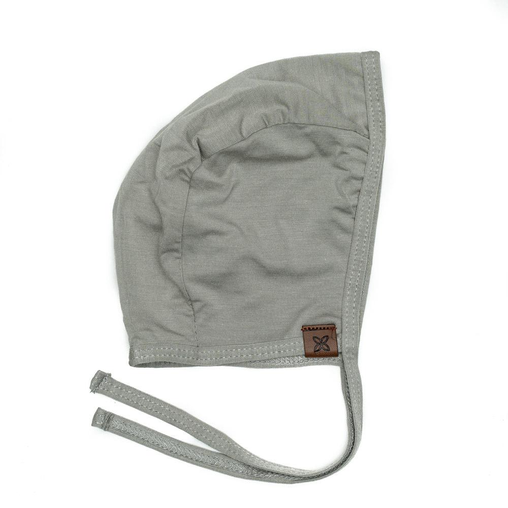 A cozy baby bonnet designed for warmth and comfort, featuring soft fabric and a snug fit, perfect for chilly weather.